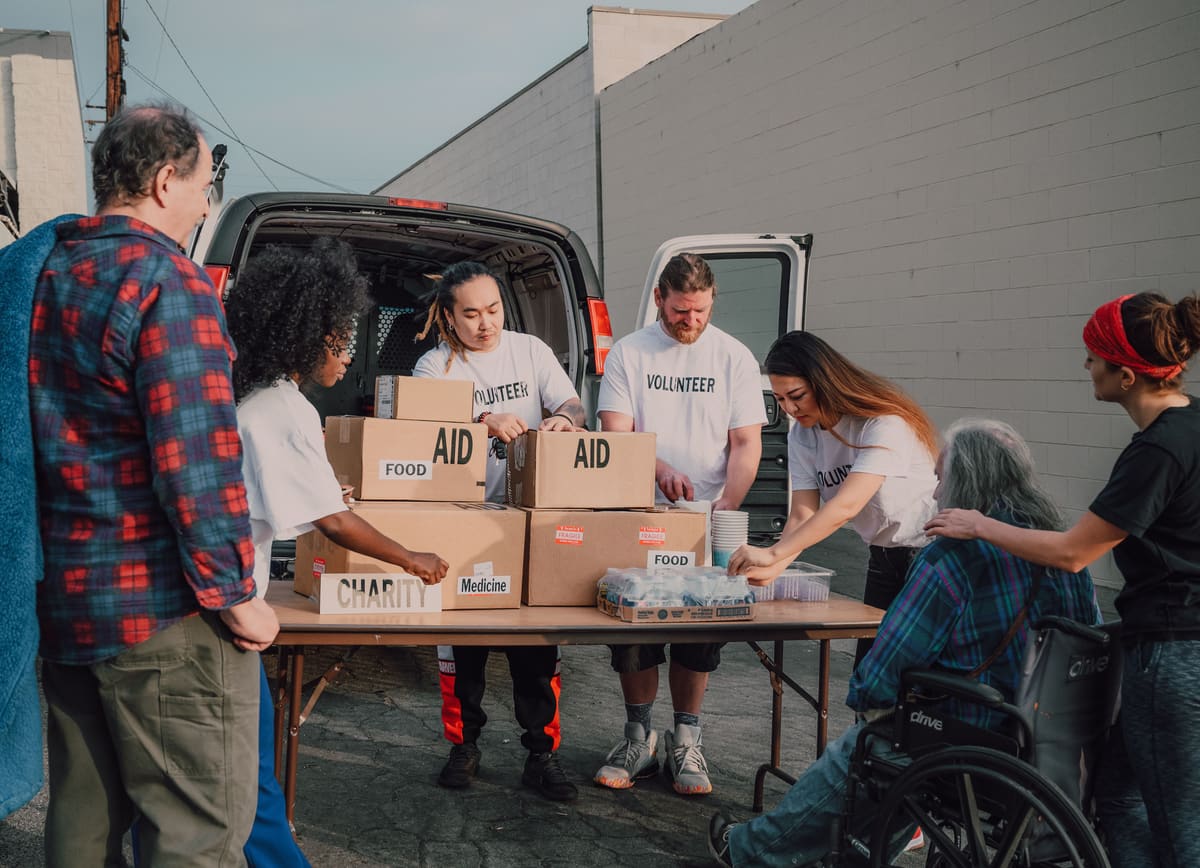 Volunteers organizing aid boxes for people they serve